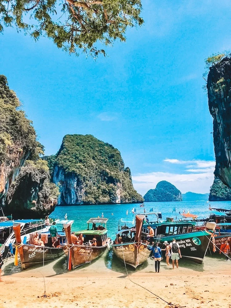 Typical Thai longboats on the beach in Koh Phangan, one of the best snorkelling and scuba diving spots in Thailand