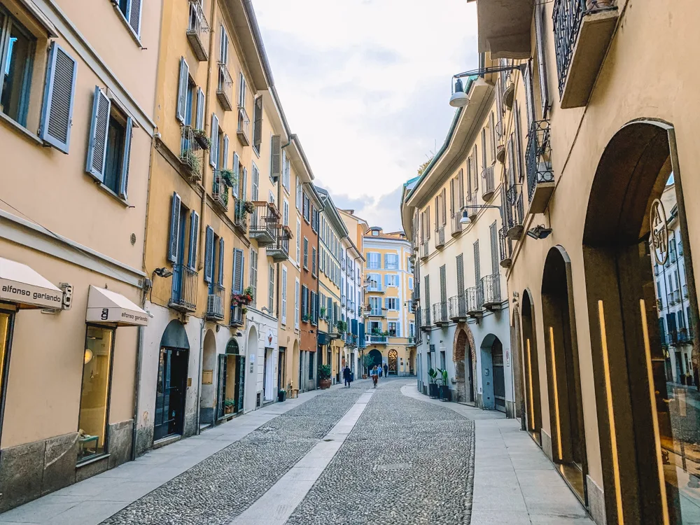 Walking along the cobbled streets of Brera neighbourhood in Milan, Italy
