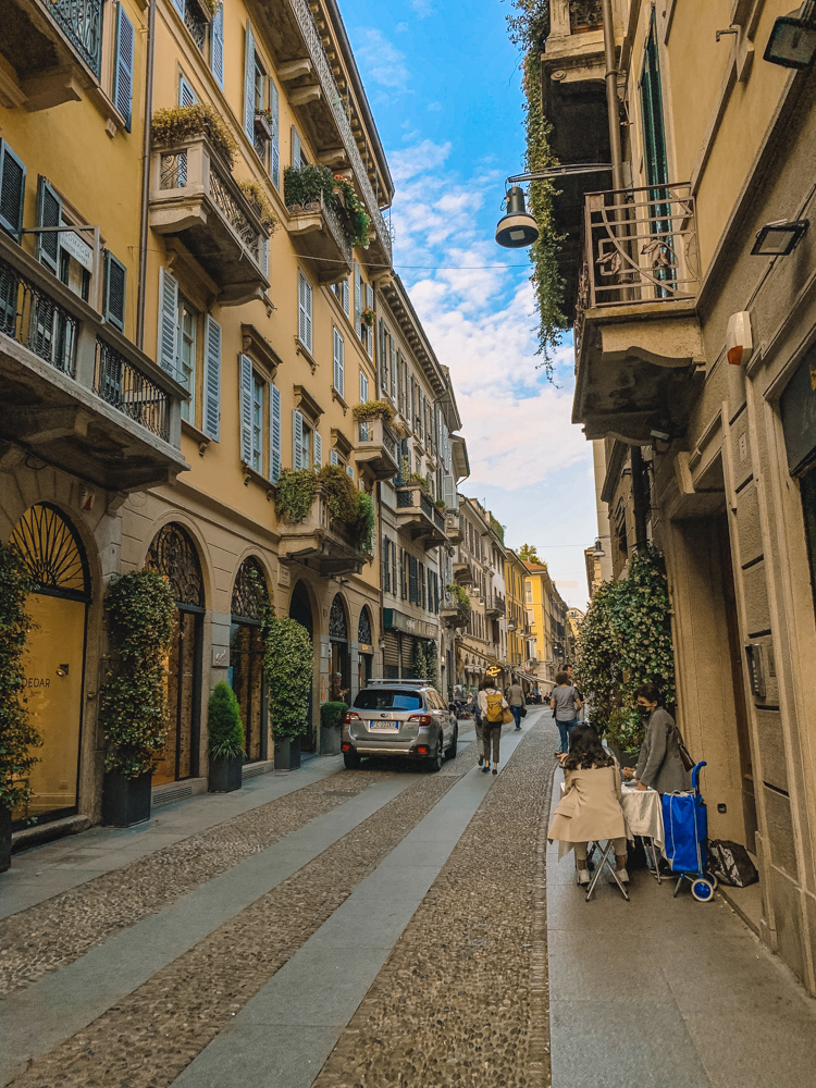 Walking along the cobbled streets of Brera neighbourhood in Milan, Italy