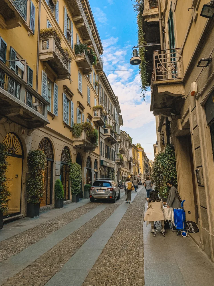 Walking along the cobbled streets of Brera neighbourhood in Milan, Italy - one of the best places to visit in Milan in 2 days