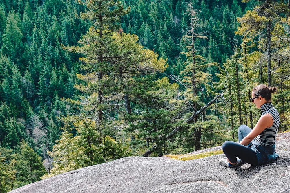 Taking a break while hiking Stawamus Chief during our Whistler road trip