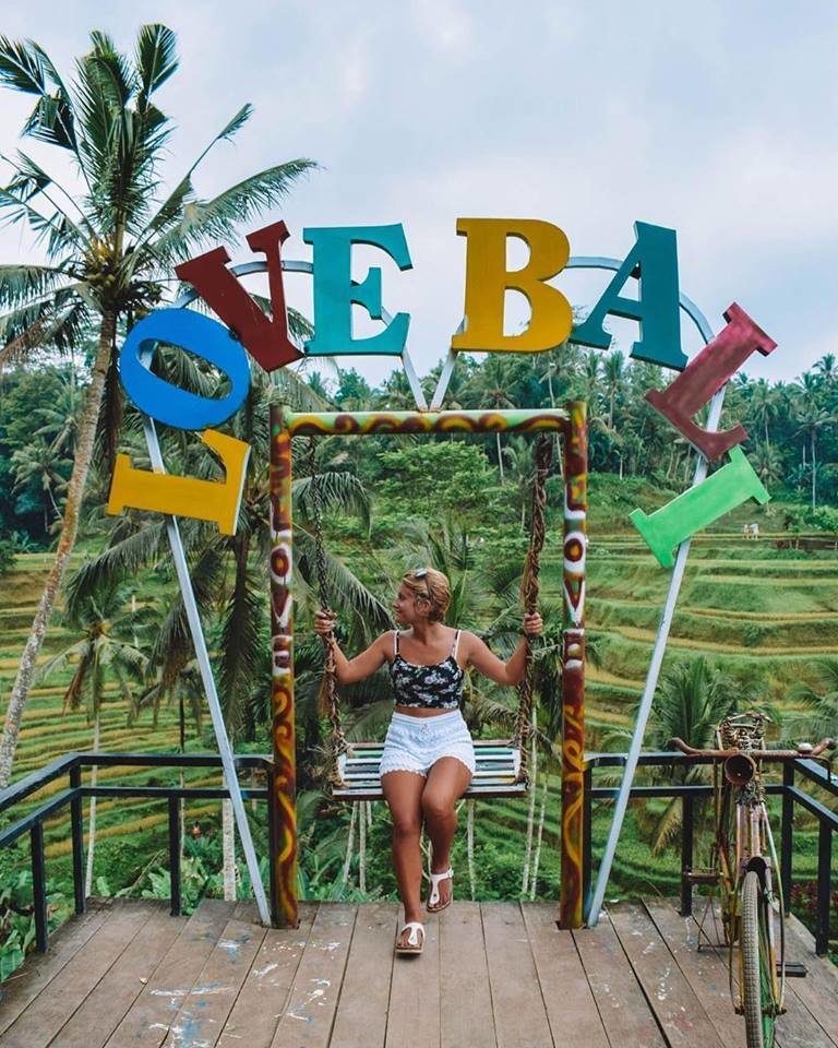 A popular tourist spot in Bali; the "Love Bali" sign at Tegalalang rice terraces