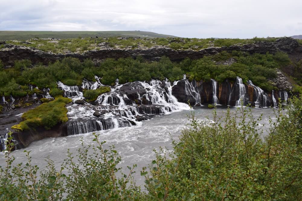 The Barnafoss falls, trickling in the river from within the lava field