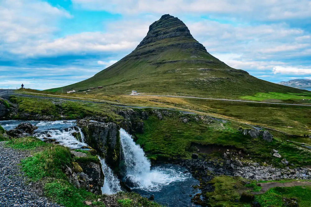 Kirkjufellsfoss waterfall with the iconic mountain in the back - one of the most scenic and famous waterfalls in Iceland