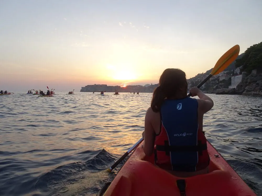 Kayaking at sunset by the harbour of Dubrovnik