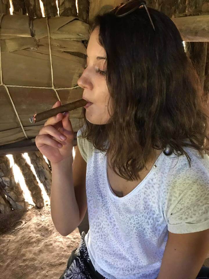 My friend Francesca trying a Cuban cigar on the tobacco plantation