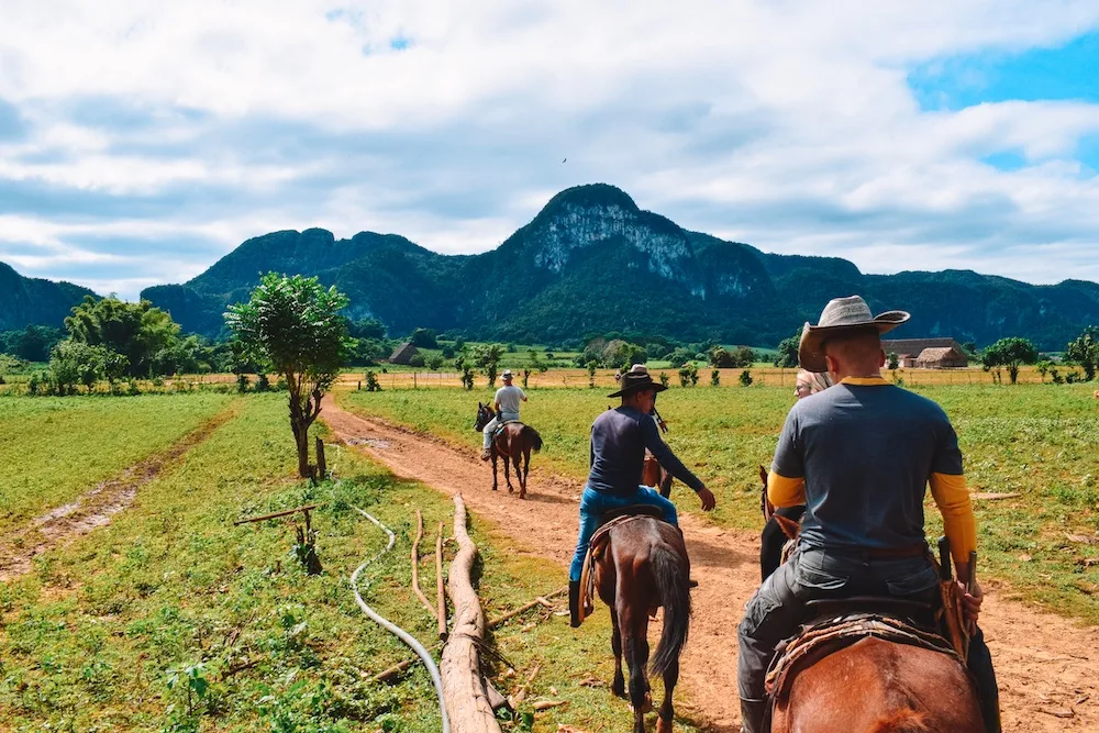 Horse riding in the valley of Vinales, Cuba.