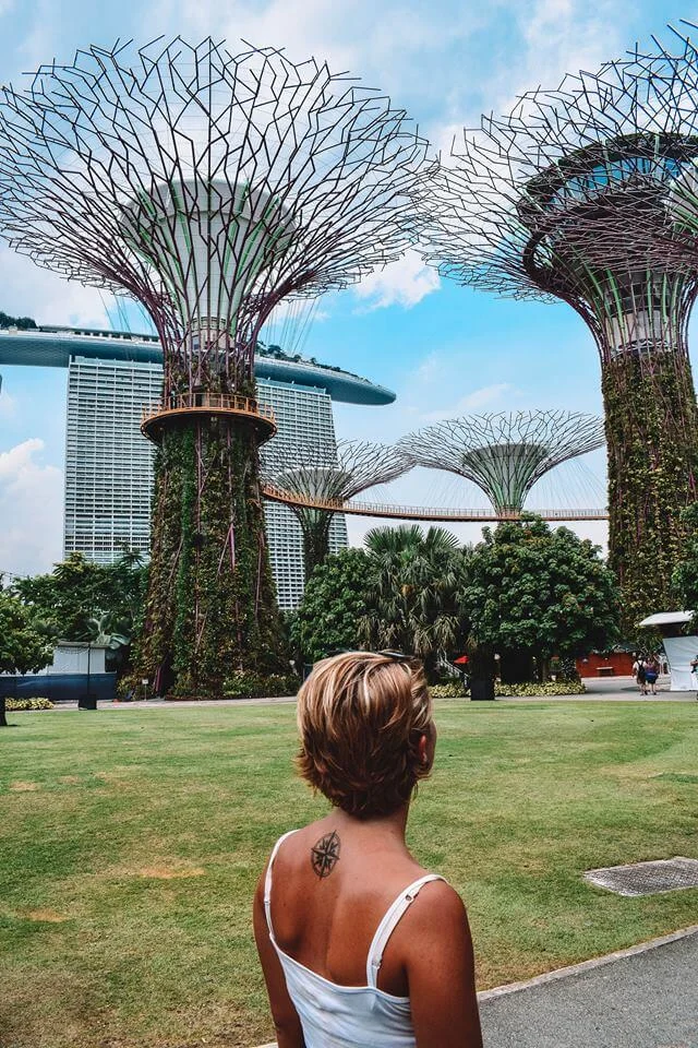 Admiring the Supertree Grove with Marina Bay Sands behind it