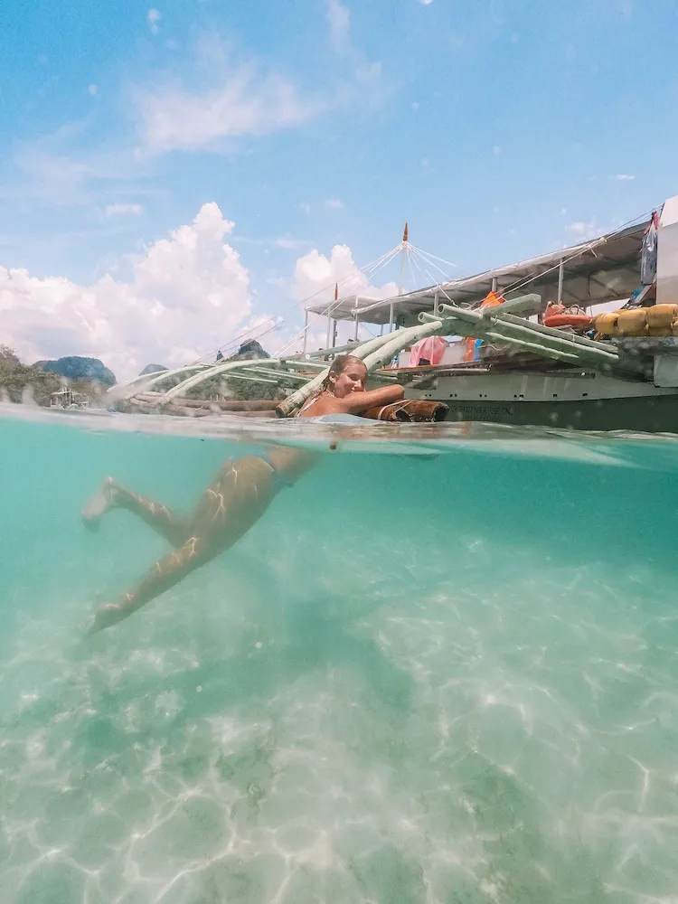 Island hopping in El Nido, Philippines - 50/50 over under water photo taken with a GoPro dome