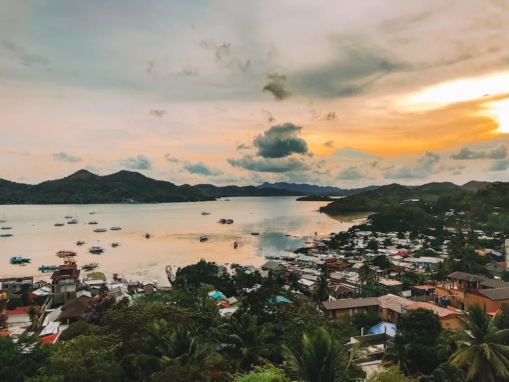 The sunset view from the rooftop bar of Hop Hostel in Coron