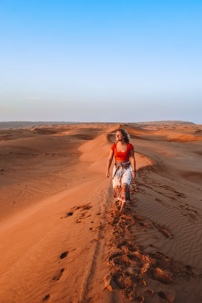 Exploring the sand dunes of the Al Wasil desert in Oman at sunrise