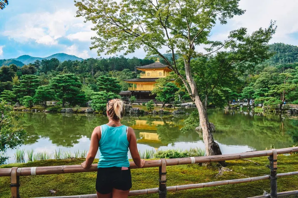 Admiring the Kinkaku-ji golden temple in Kyoto