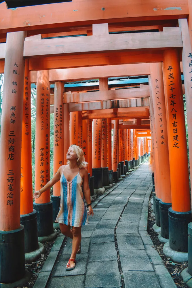 Wandering through the famous red torii gates of Fushimi Inari Taisha in Kyoto