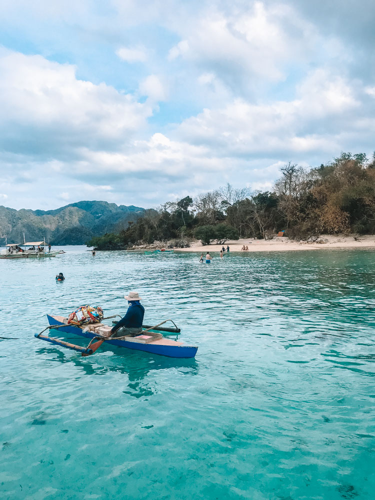 One of the local vendors who sell drinks and snacks to tourists on the tour boats in Coron