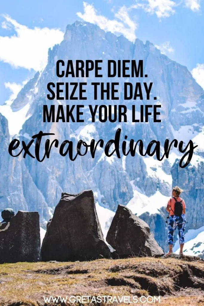 Girl standing at the top of a mountain looking at the view with text overlay saying "Carpe diem. Sieze the day. Make your life extraordinary"