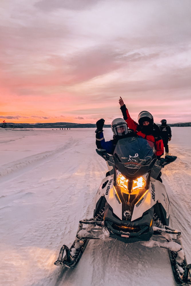 Doing a snowmobile tour in Inari, Lapland