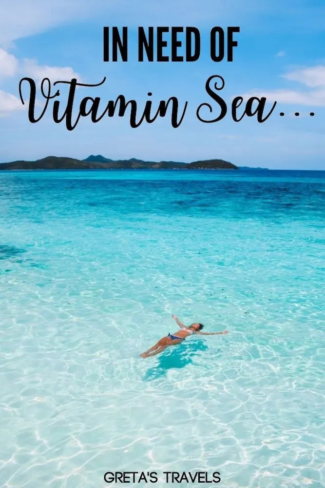 Photo of a girl floating in the turquoise water of Malcapuya Island with text overlay saying "In need of vitamin sea" - a perfect Instagram caption for travel beach photos