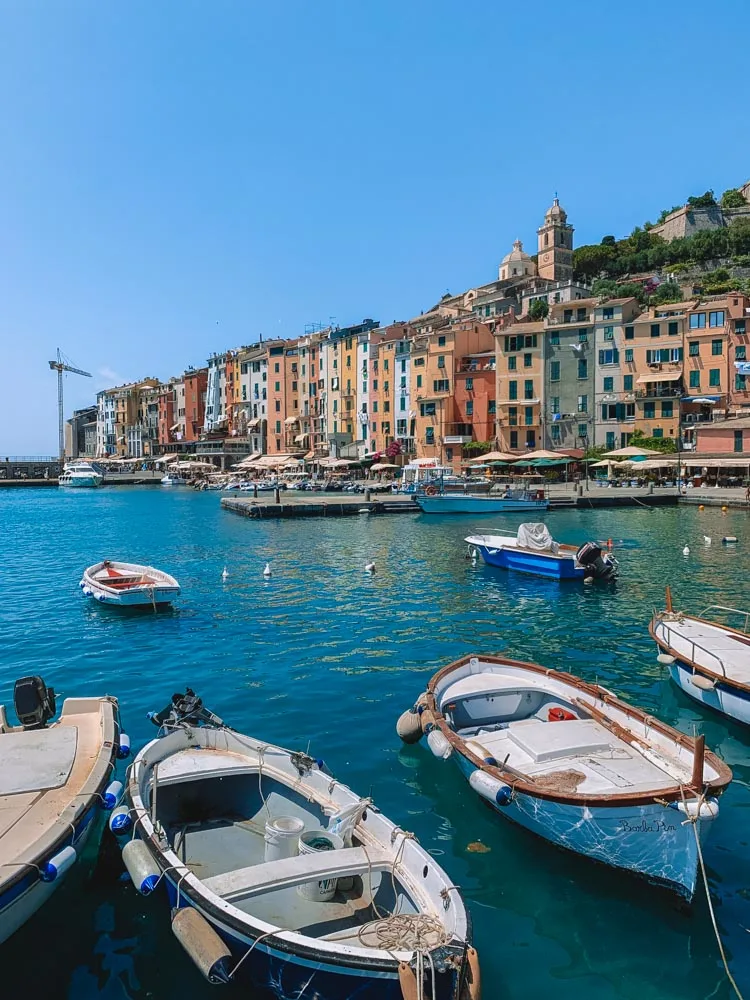 The harbour and colourful houses of Porto Venere in Italy - a perfect place to stay in Cinque Terre for those looking for a hidden gem