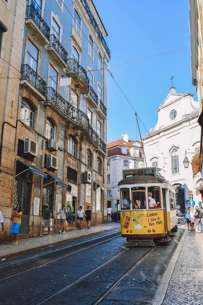 The famous tram 28 making its way around Alfama in Lisbon