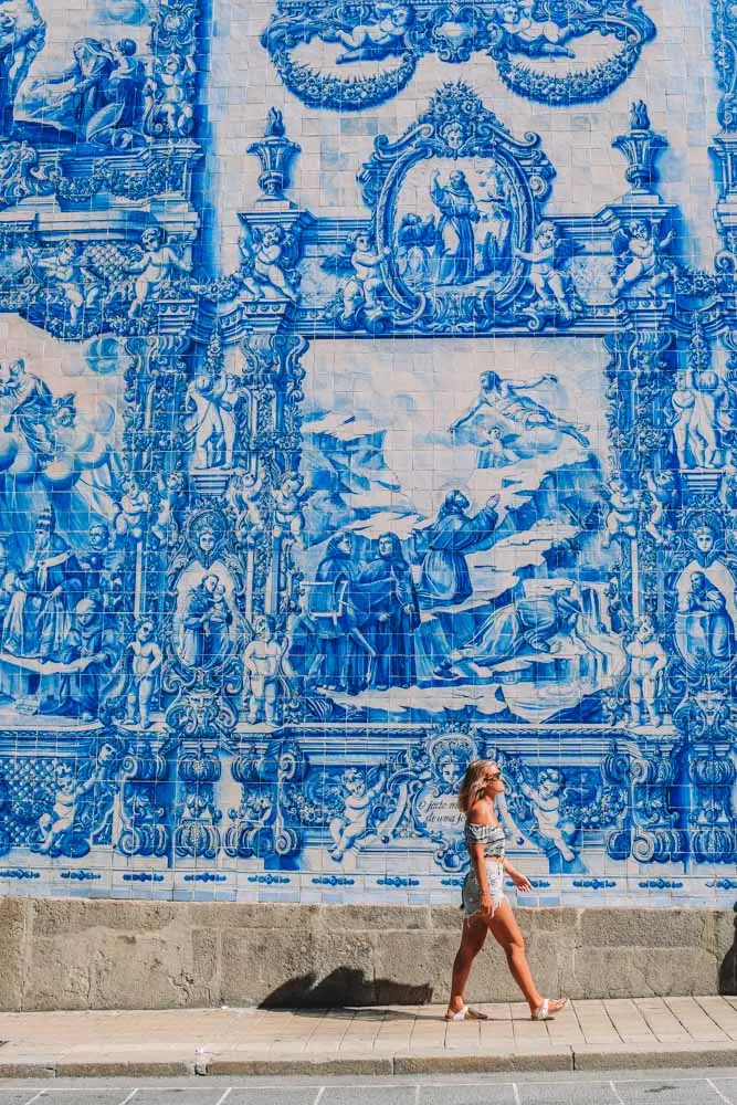 Admiring the famous azulejos facade of the Chapel of Souls in Porto