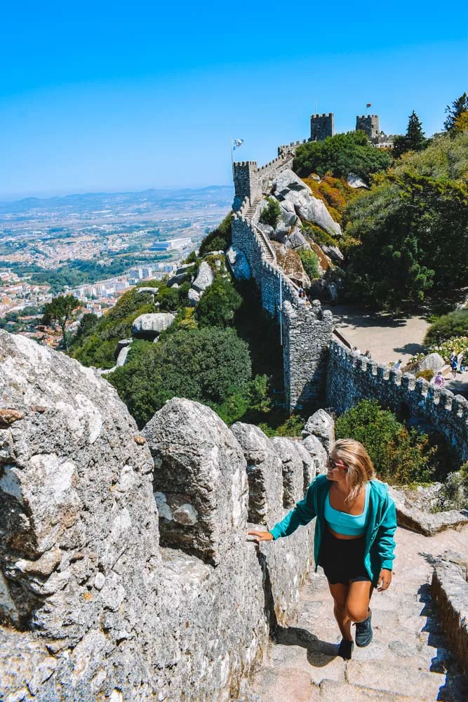 Exploring Castle of the Moors in Sintra, Portugal - one of the most popular day trip destinations from Lisbon