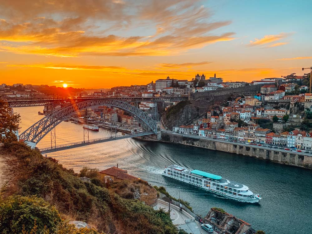 Enjoying the sunset over Porto and the Douro River from Kittie Rock - close to one of the most romantic places to stay in Porto for couples