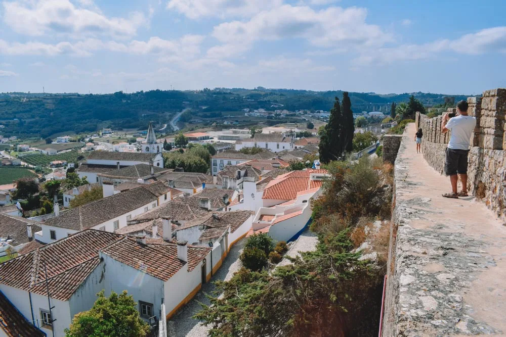 Walking the castle walls of Obidos in Portugal