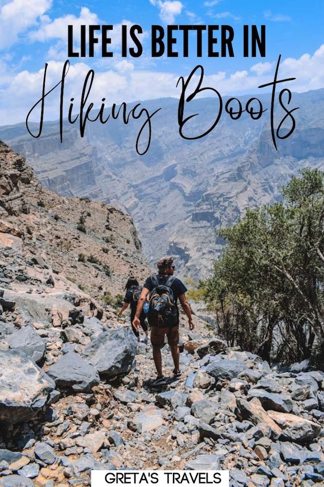Photo of a guy hiking along the Jebel Shams Balcony Walk in Oman with text overlay saying "Life is better in hiking boots" - a short and funny trekking quote!