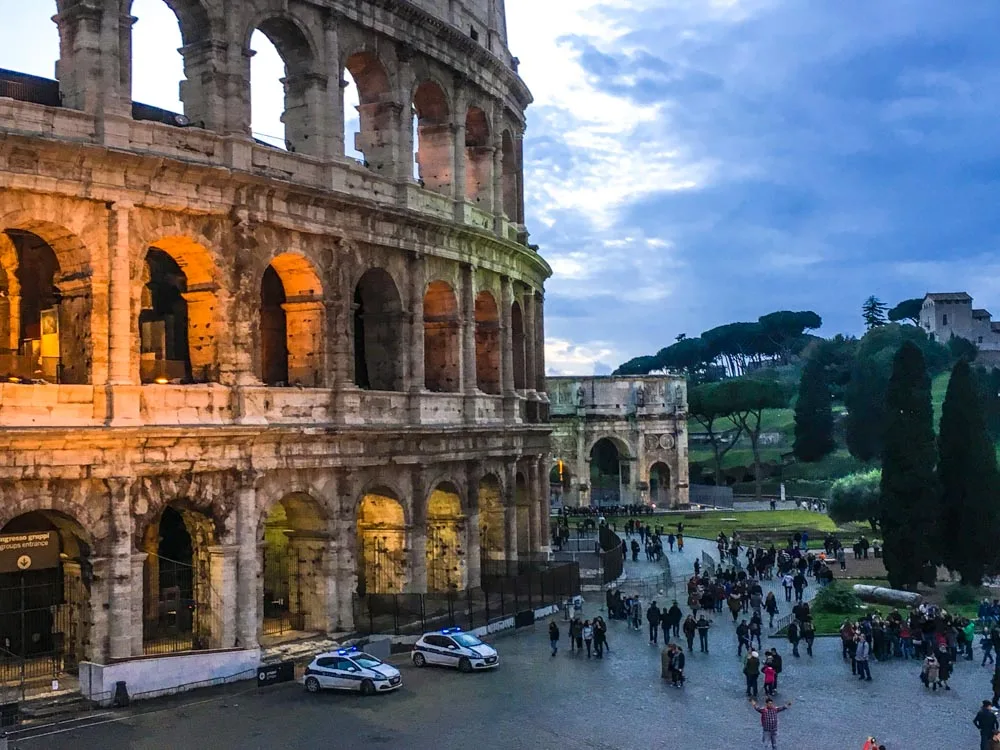 The Colosseum in Rome at sunset - one of the best places to spend Christmas in Italy
