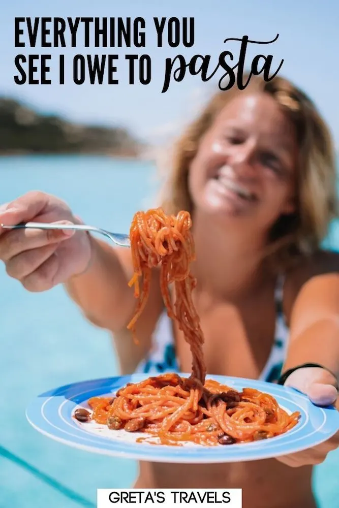 Photo of a blonde girl holding up a plate of tomato spaghetti with text overlay saying “Everything you see I owe to pasta.”