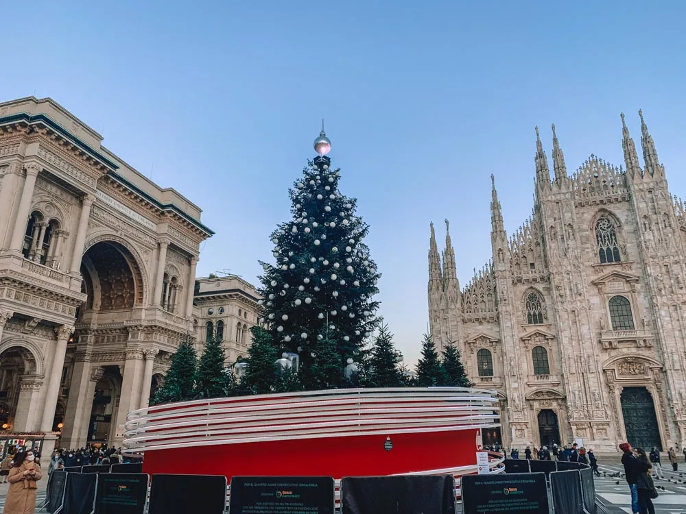 Piazza del Duomo in Milan at Christmas, with Galleria Vittorio Emanuele and Milan Cathedral behind it