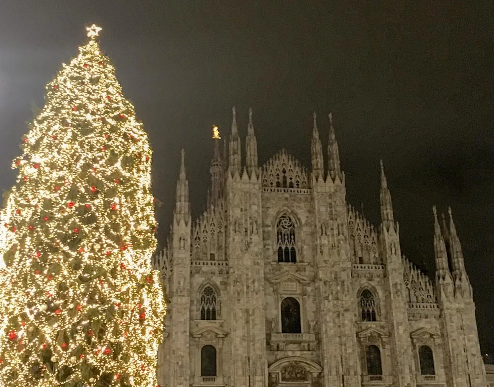 The huge Christmas tree of Piazza del Duomo with Milan Cathedral behind it