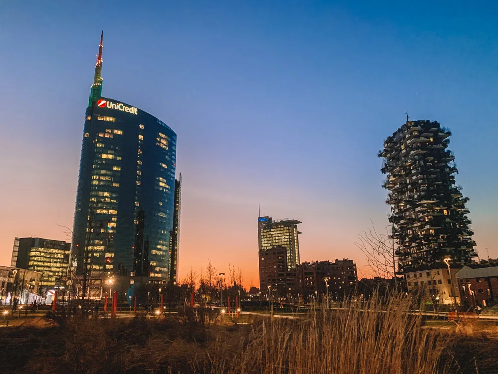Sunset over Piazza Gae Aulenti and the Bosco Verticale in Milan, Italy