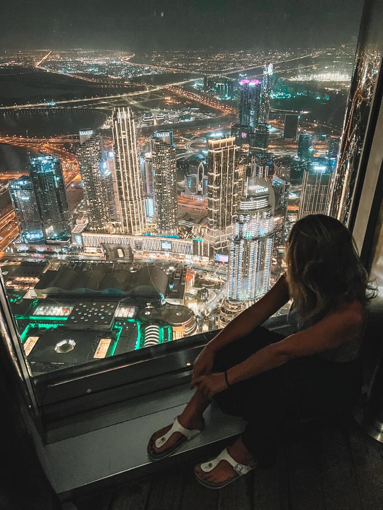 Enjoying the view over Dubai at night from the Burj Khalifa