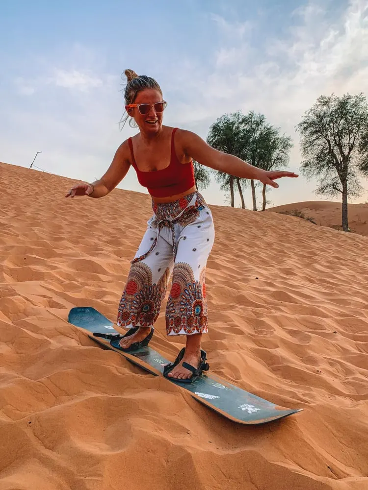 Me trying my hand at sandboarding in Dubai