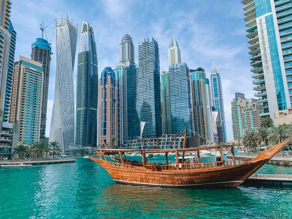 A traditional wooden dhow boat in Dubai Marina