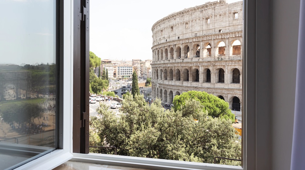 The Colosseum view from the window of Giallo Colosseo in Rome, Italy