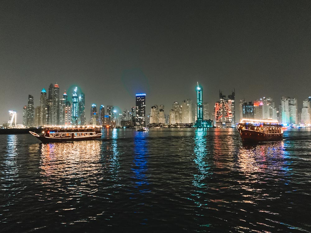 Wooden dhow boats cruising in Dubai Marina