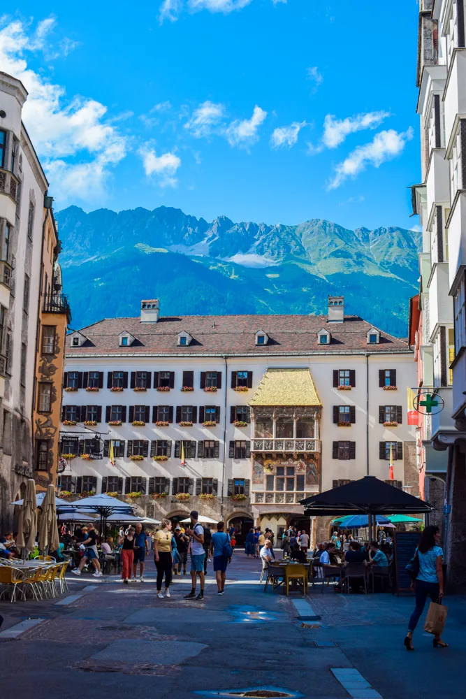 An iconic Innsbruck sight; the Old Town Centre, Golden Roof & mountains behind it