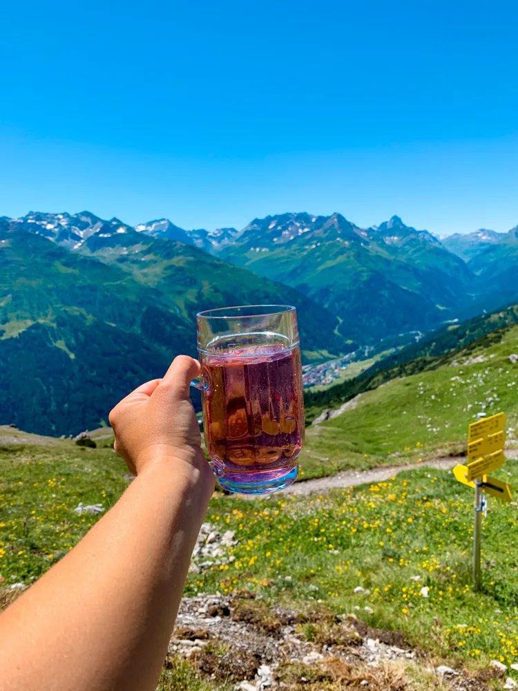 Drinking skiwasser (a local drink with water & raspberry) at Leutkircher Hütte