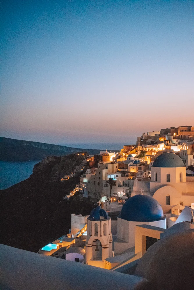 The blue domed church of Santorini at sunset