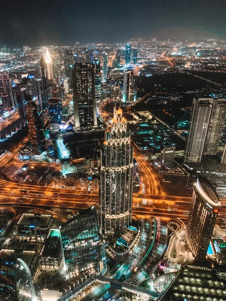 Enjoying the Dubai skyline lit up for the night from Burj Khalifa