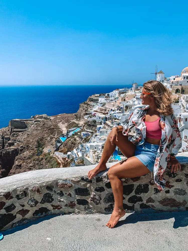 Enjoying the view from Oia Castle in Santorini