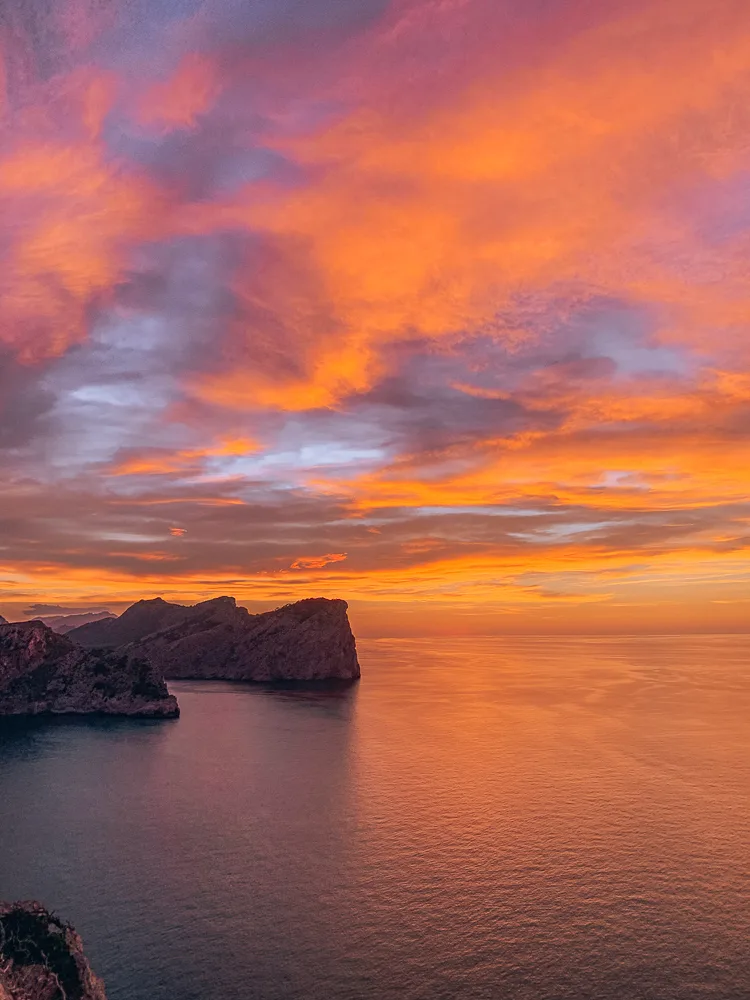 The magical red sunset over the Mallorcan coastline as seen from Faro de Formentor