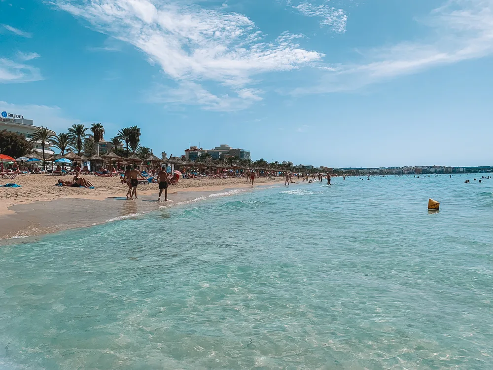 The turquoise sea and beach of S'Arenal in Mallorca