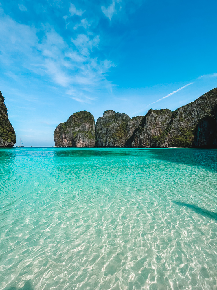 The crystal clear water and towering cliffs of Maya Bay in Thailand