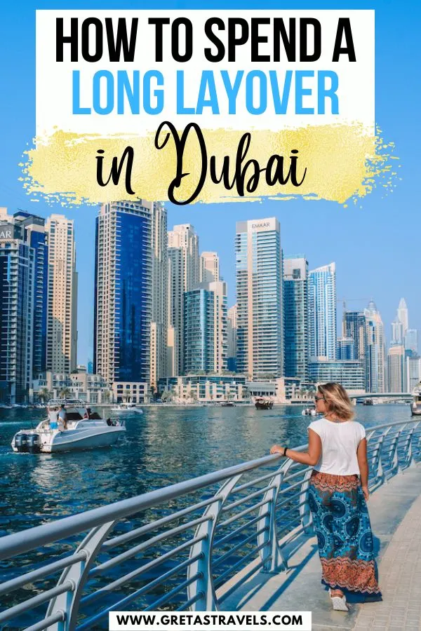 Photo of a blonde girl in a blue jumpsuit walking along Dubai Marina with text overlay saying "how to spend a long layover in Dubai"
