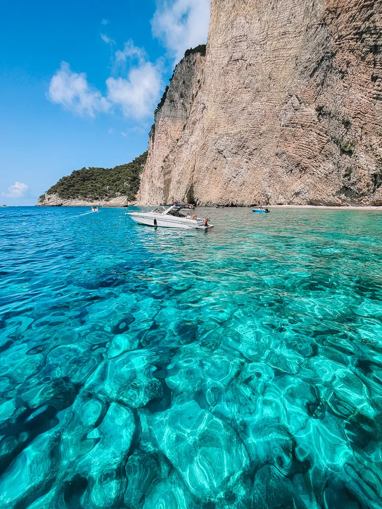 Exploring the coastline and turquoise sea of Zakynthos, Greece, by boat