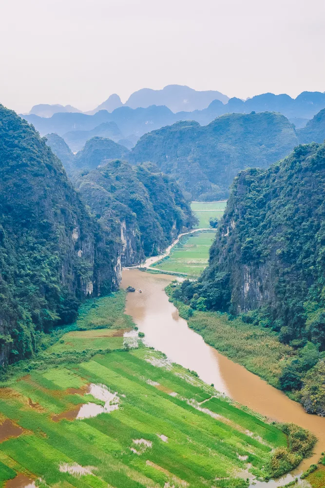 View over the mountains, rice fields and river of Ninh Binh as seen from Hang Mua Caves Viewpoint in Ninh Binh, Vietnam