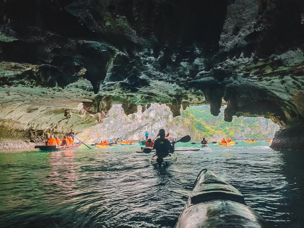 Kayaking through the caves of Halong Bay, Vietnam